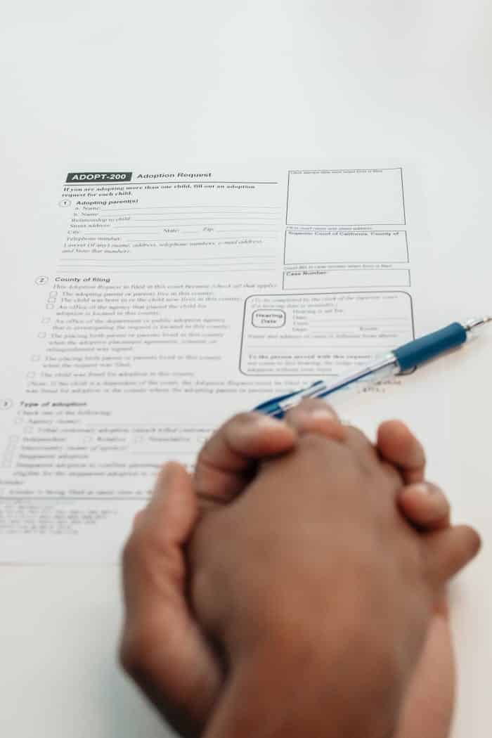 Person Writing on White Paper